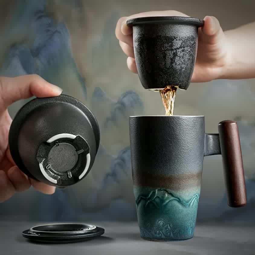 Handmade ceramic tea cup with strainer lid and wooden handle