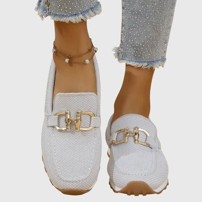 Women's slip-on loafers with gold-tone trim and cushioned insole