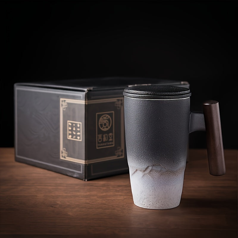 Handmade ceramic tea cup with strainer lid and wooden handle