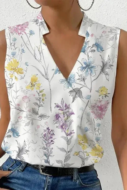 Women's sleeveless V-neck blouse with wrap front and floral print