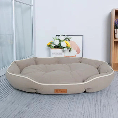 Soft oval cushioned dog bed with bolster edge