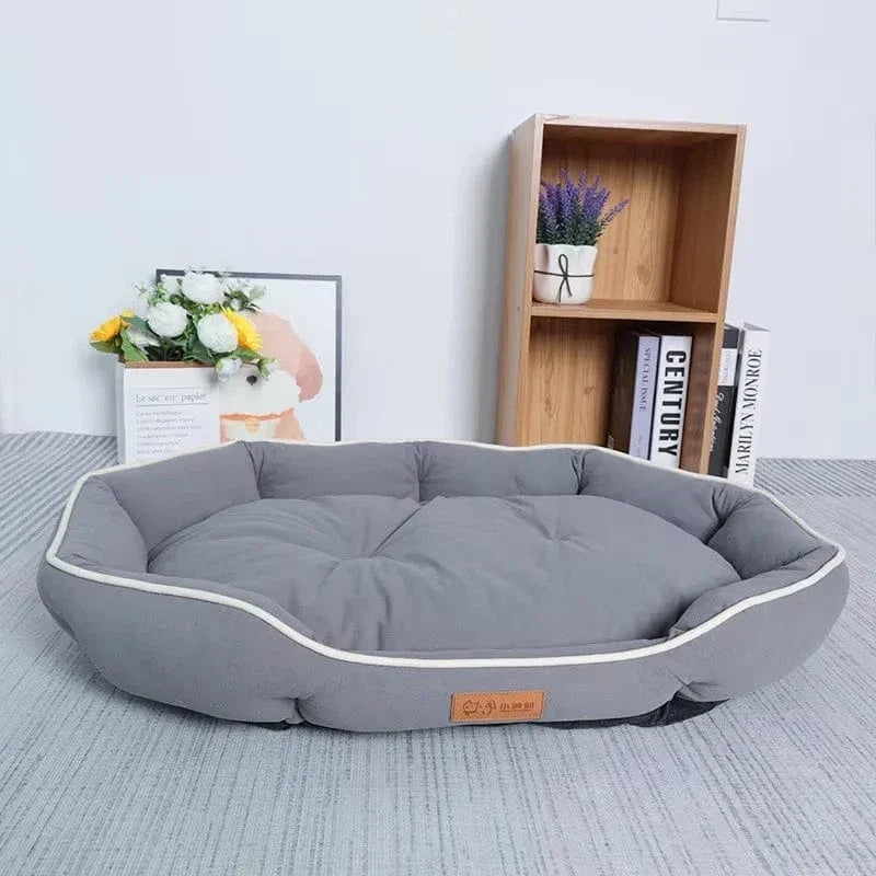 Soft oval cushioned dog bed with bolster edge