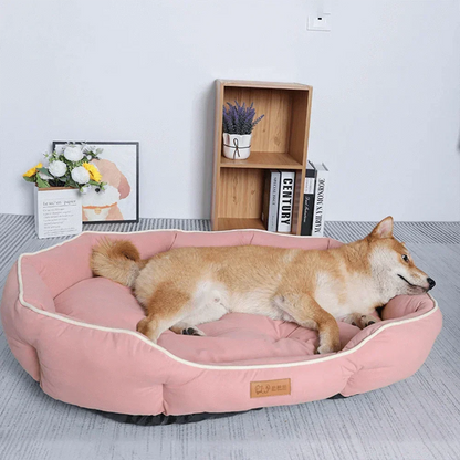 Soft oval cushioned dog bed with bolster edge