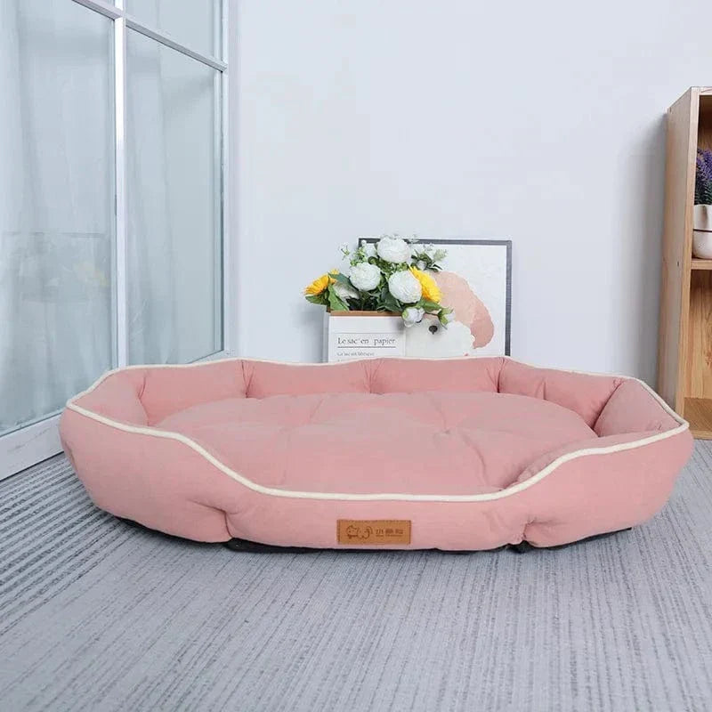 Soft oval cushioned dog bed with bolster edge