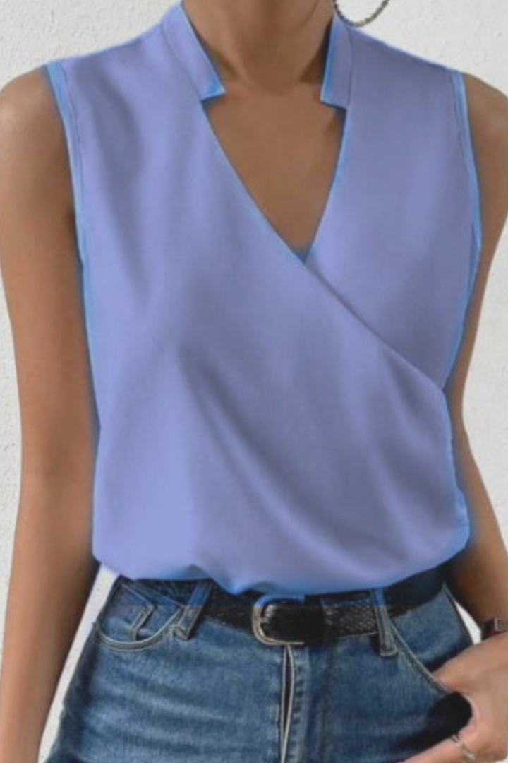 Women's sleeveless V-neck blouse with wrap front and floral print