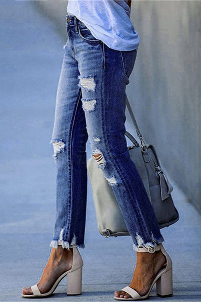Women's distressed straight-leg jeans with a raw hem in denim