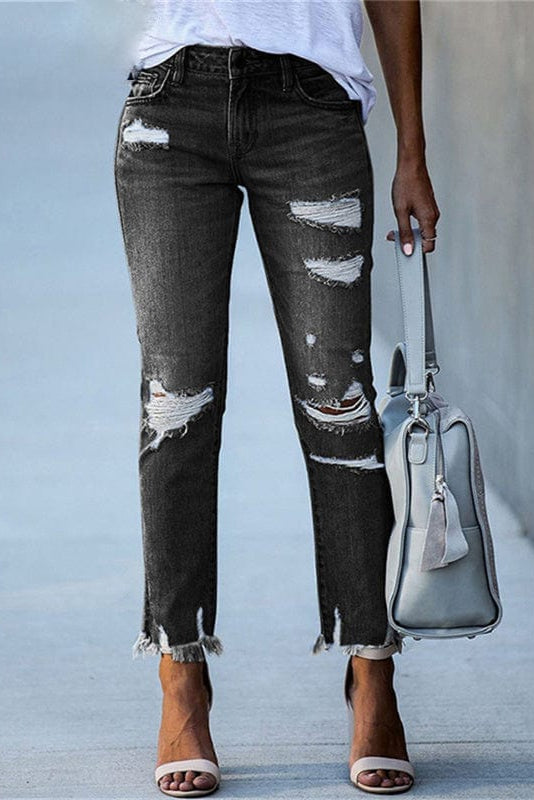 Women's distressed straight-leg jeans with a raw hem in denim