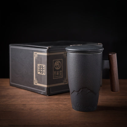 Handmade ceramic tea cup with strainer lid and wooden handle
