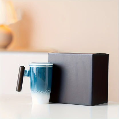 Handmade ceramic tea cup with strainer lid and wooden handle