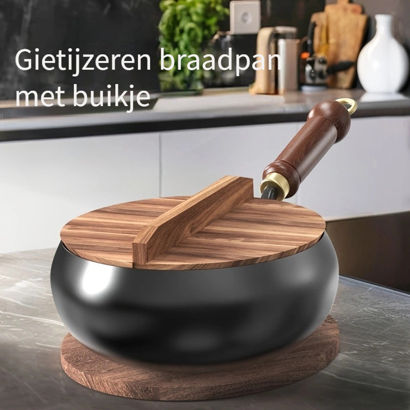 Cast iron pan with wooden handle and lid