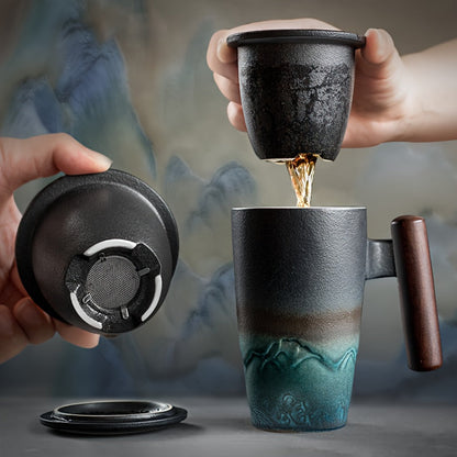 Handmade ceramic tea cup with strainer lid and wooden handle