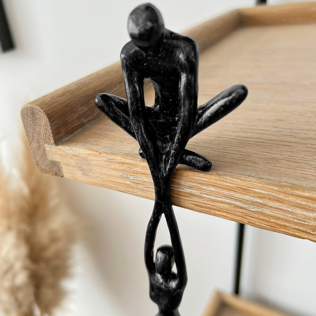 Modern two-figure sculpture statue in black