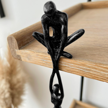 Modern two-figure sculpture statue in black