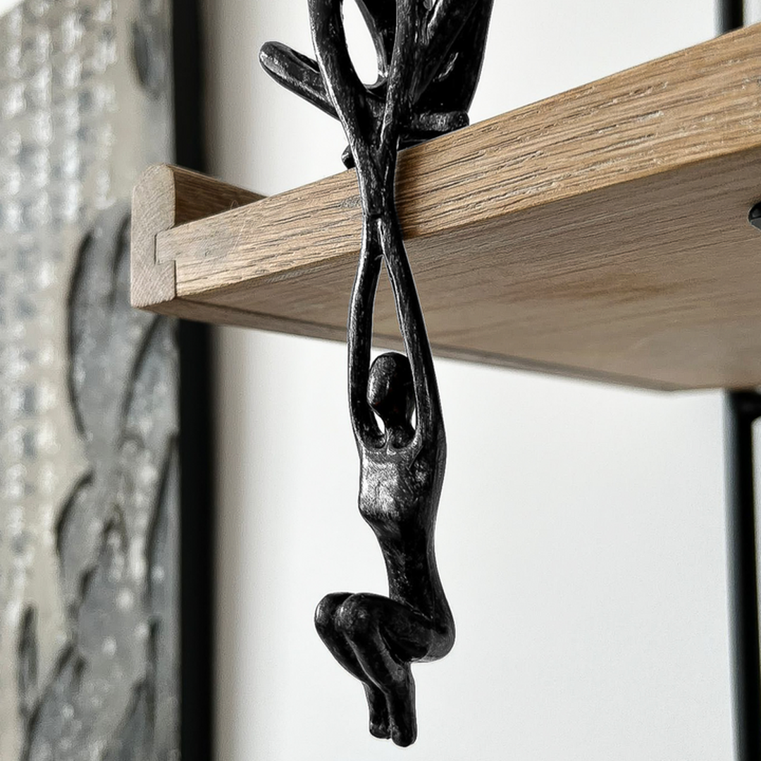 Modern two-figure sculpture statue in black