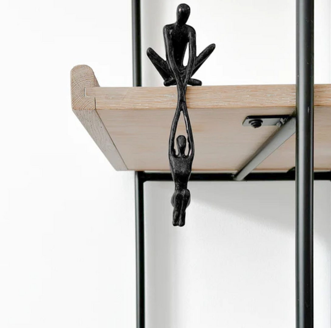 Modern two-figure sculpture statue in black