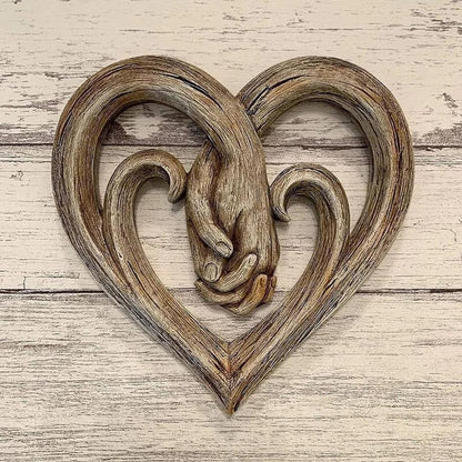 Heart and hands sculptural wall decoration