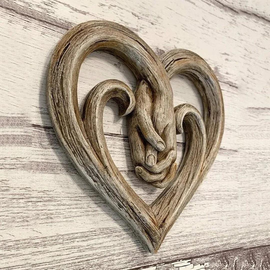 Heart and hands sculptural wall decoration
