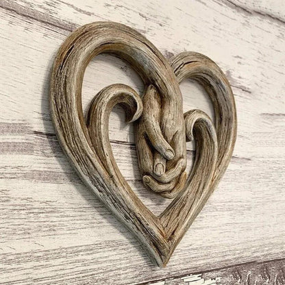 Heart and hands sculptural wall decoration