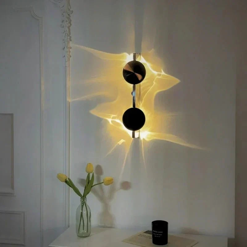 Rotatable sculptural LED effect wall light