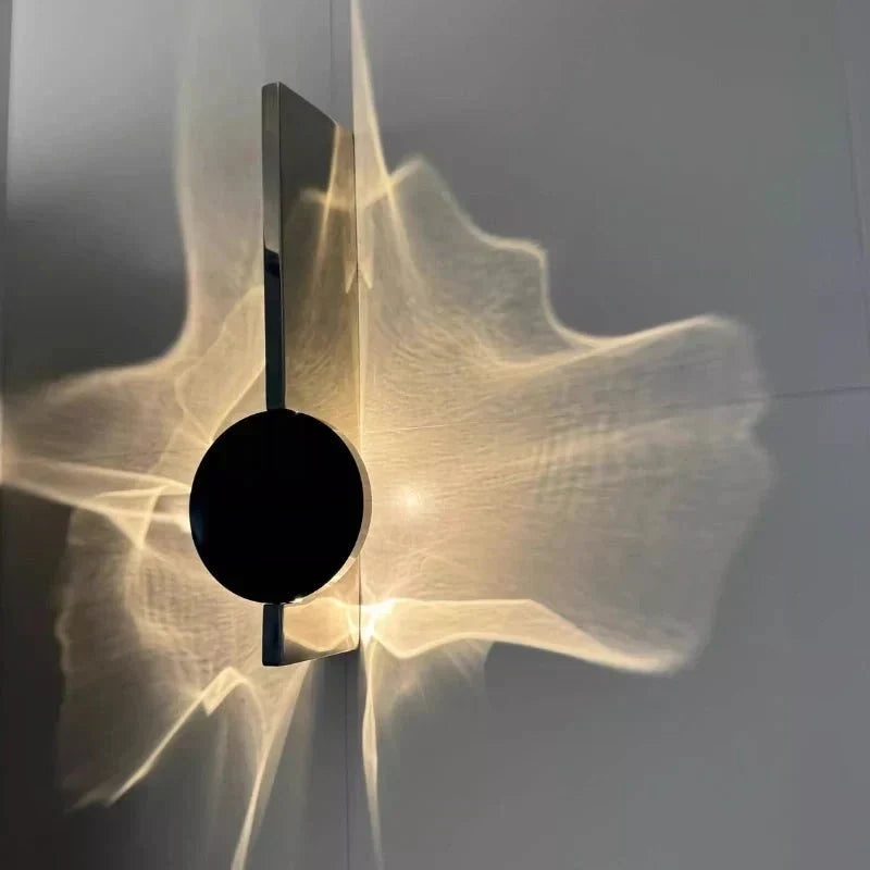 Rotatable sculptural LED effect wall light