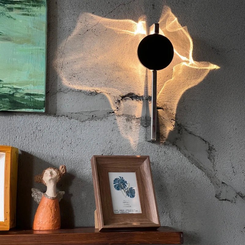 Rotatable sculptural LED effect wall light