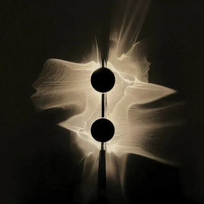 Rotatable sculptural LED effect wall light