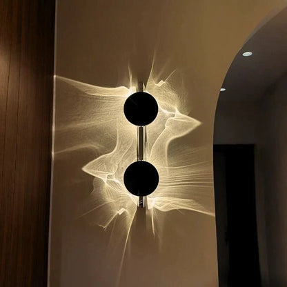 Rotatable sculptural LED effect wall light
