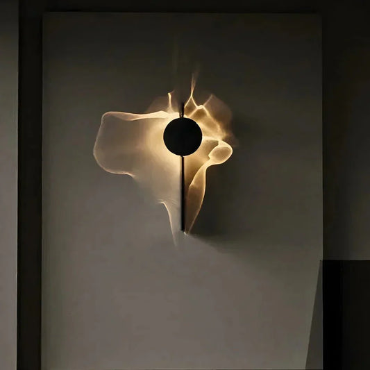 Rotatable sculptural LED effect wall light