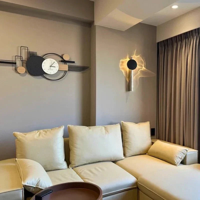Rotatable sculptural LED effect wall light