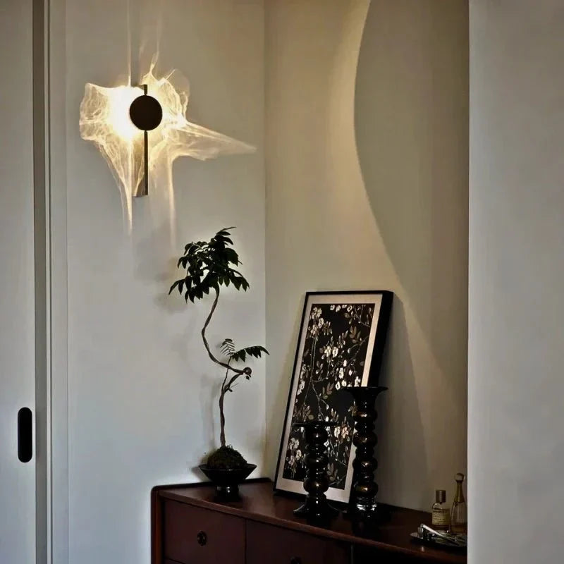 Rotatable sculptural LED effect wall light