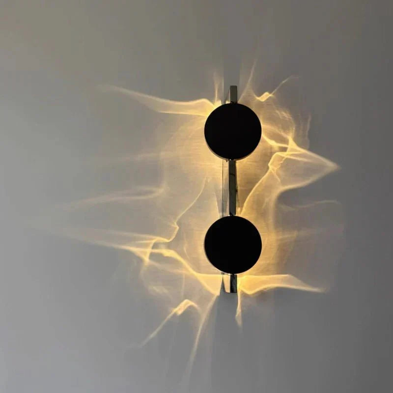 Rotatable sculptural LED effect wall light