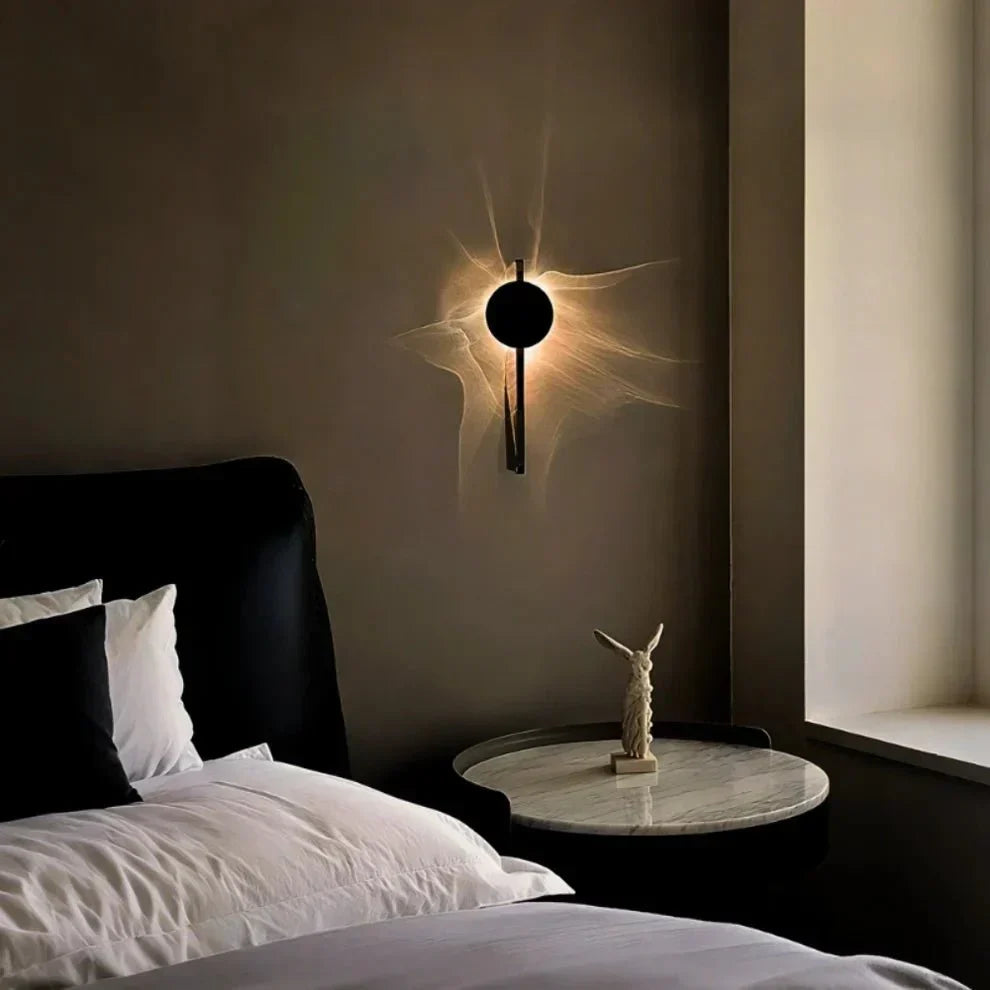 Rotatable sculptural LED effect wall light