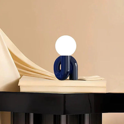Sculptural curved glass globe table lamp