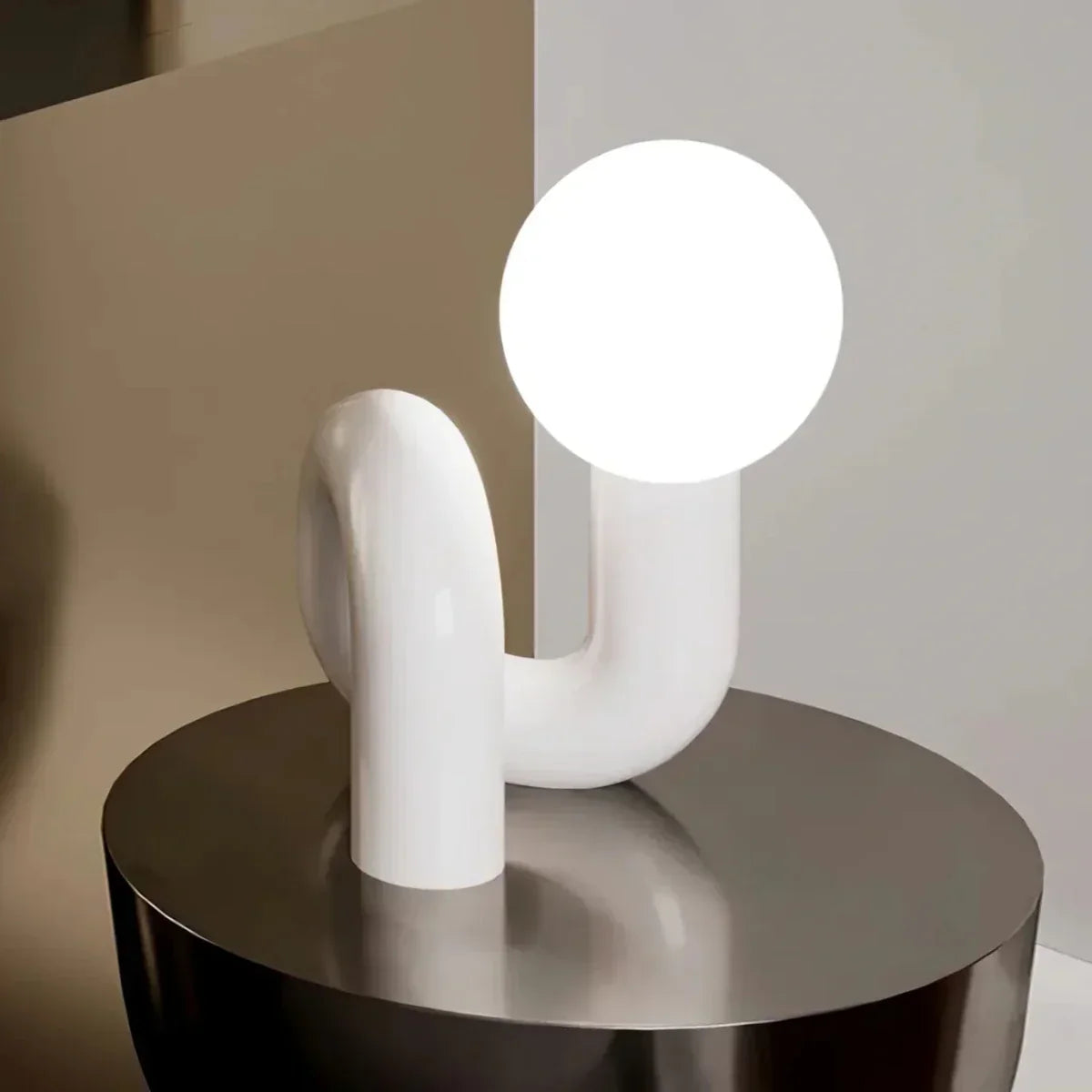 Sculptural curved glass globe table lamp