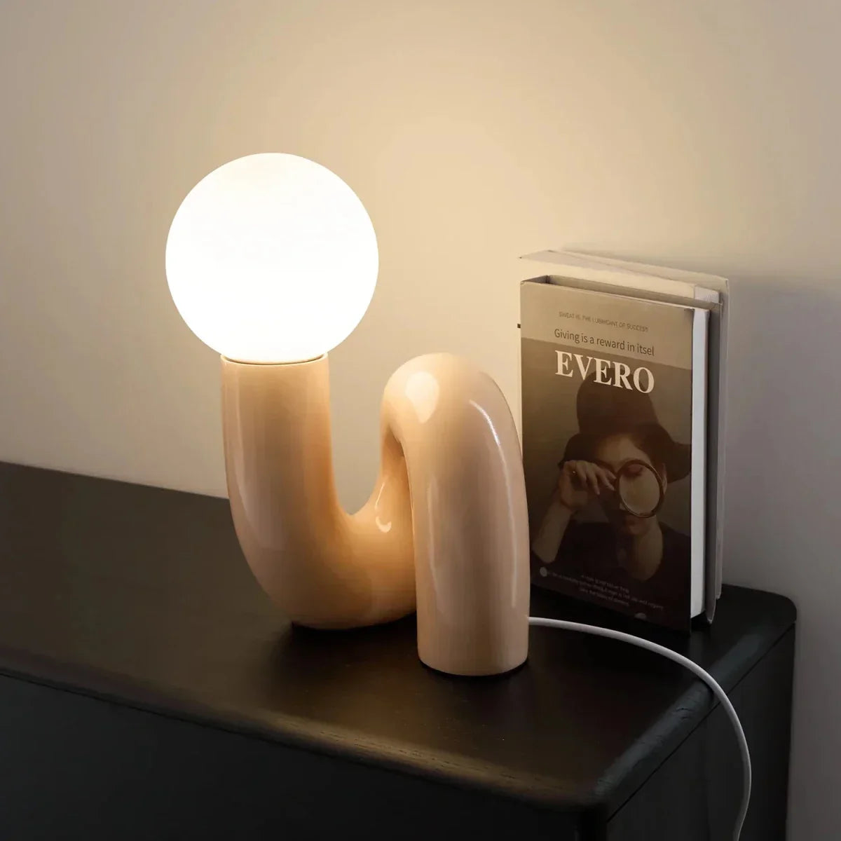 Sculptural curved glass globe table lamp