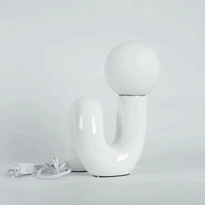 Sculptural curved glass globe table lamp