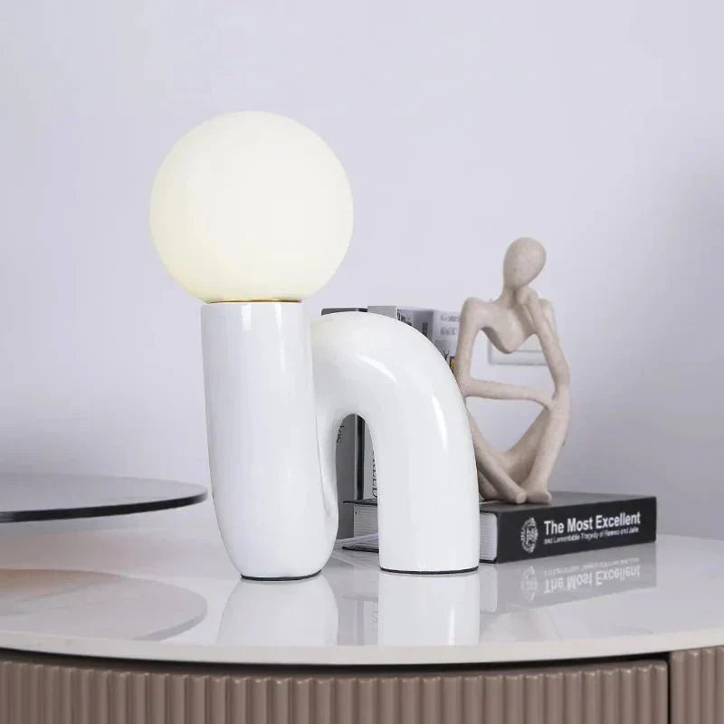 Sculptural curved glass globe table lamp