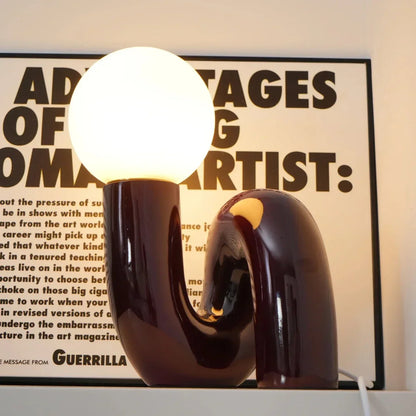 Sculptural curved glass globe table lamp