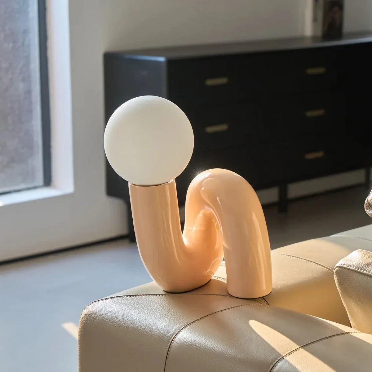 Sculptural curved glass globe table lamp