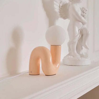 Sculptural curved glass globe table lamp