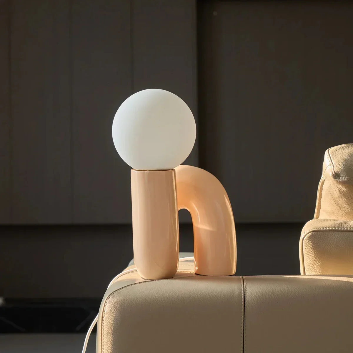 Sculptural curved glass globe table lamp