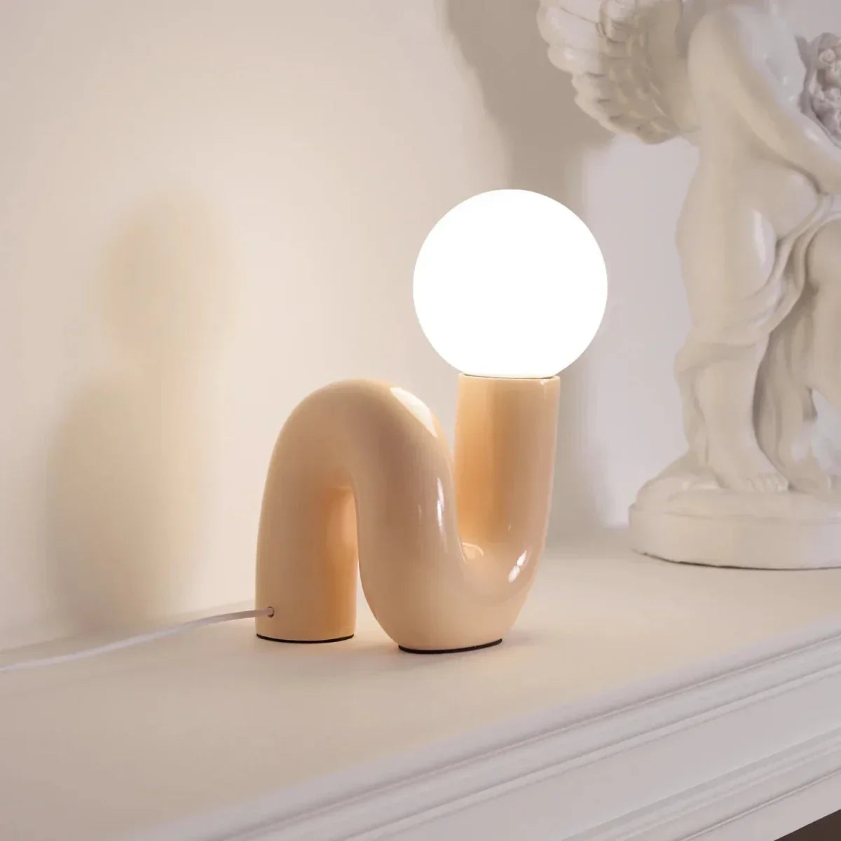 Sculptural curved glass globe table lamp