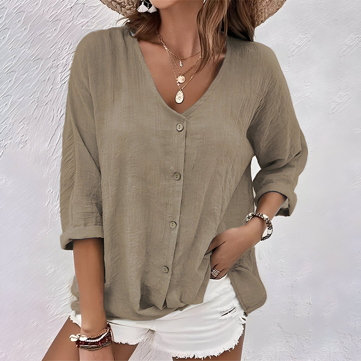 Women's relaxed V-neck button-up blouse with roll sleeves