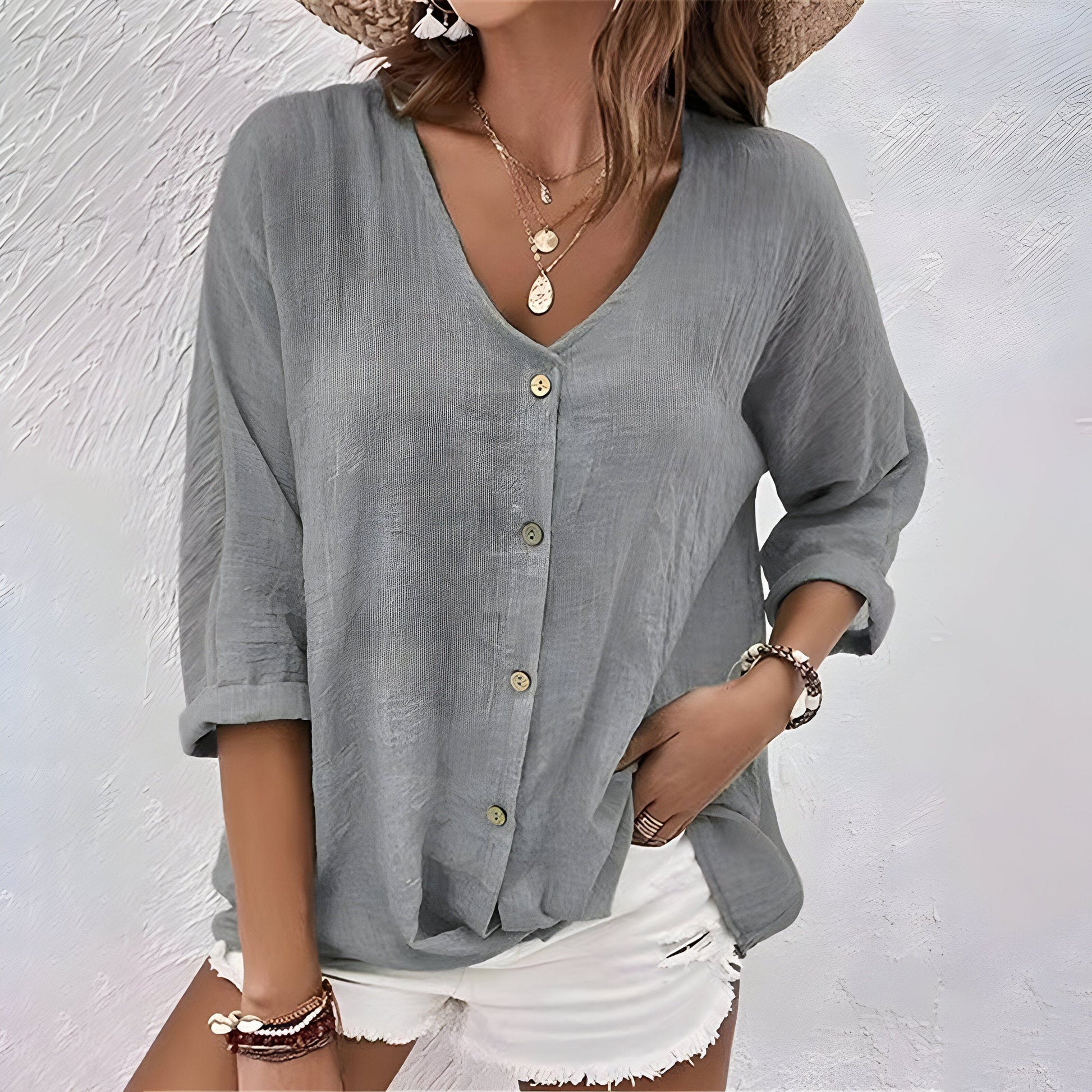 Women's relaxed V-neck button-up blouse with roll sleeves