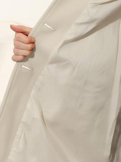 Women's single-breasted cotton trench coat in a longline winter silhouette