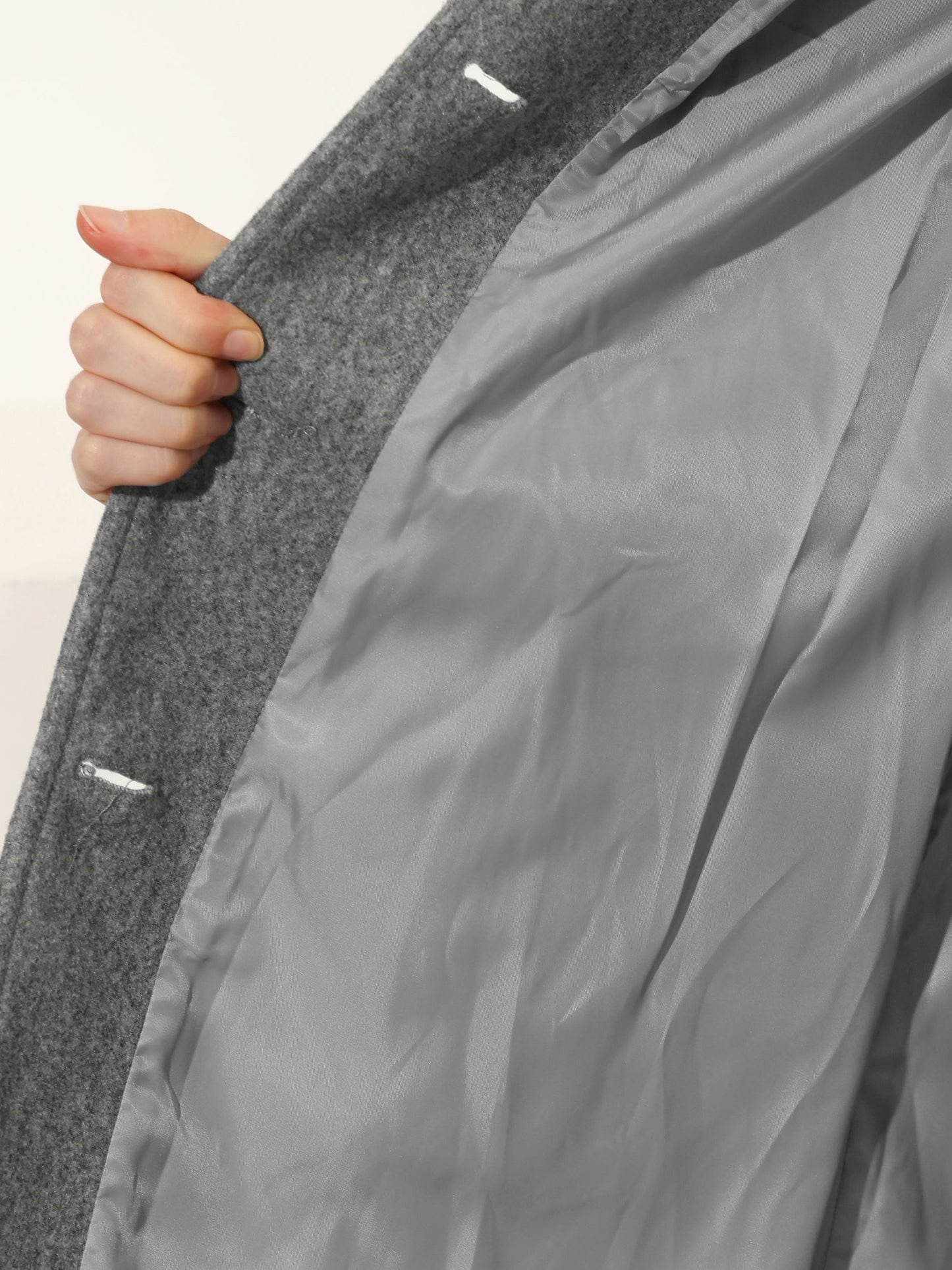 Women's single-breasted cotton trench coat in a longline winter silhouette