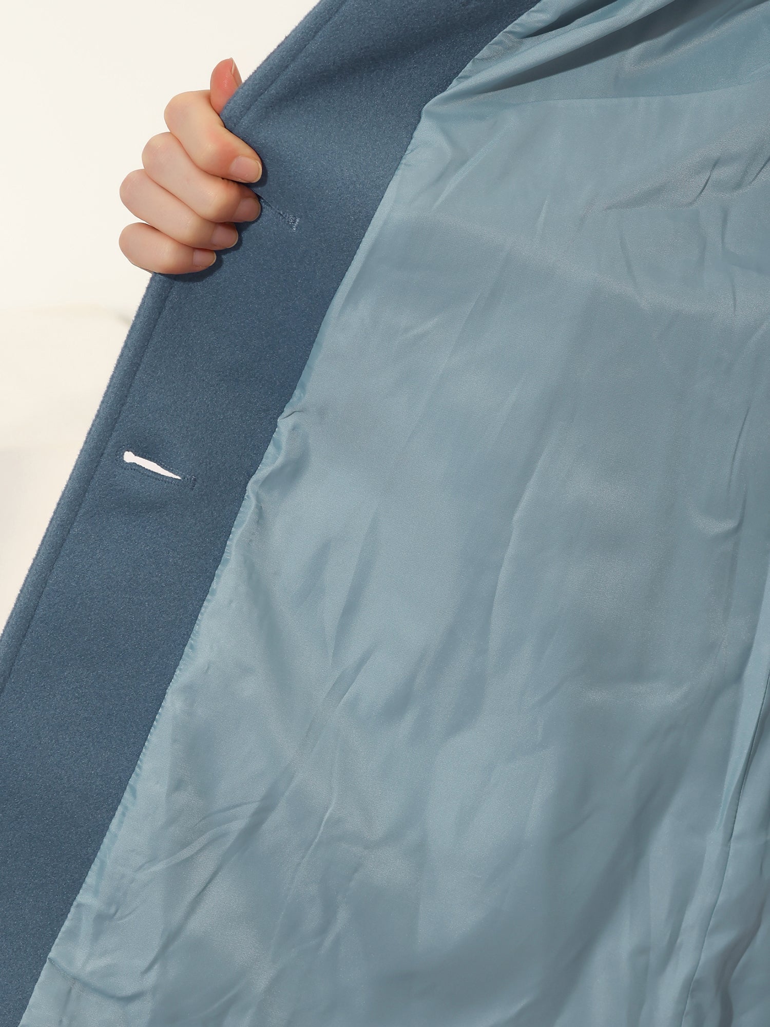 Women's single-breasted cotton trench coat in a longline winter silhouette