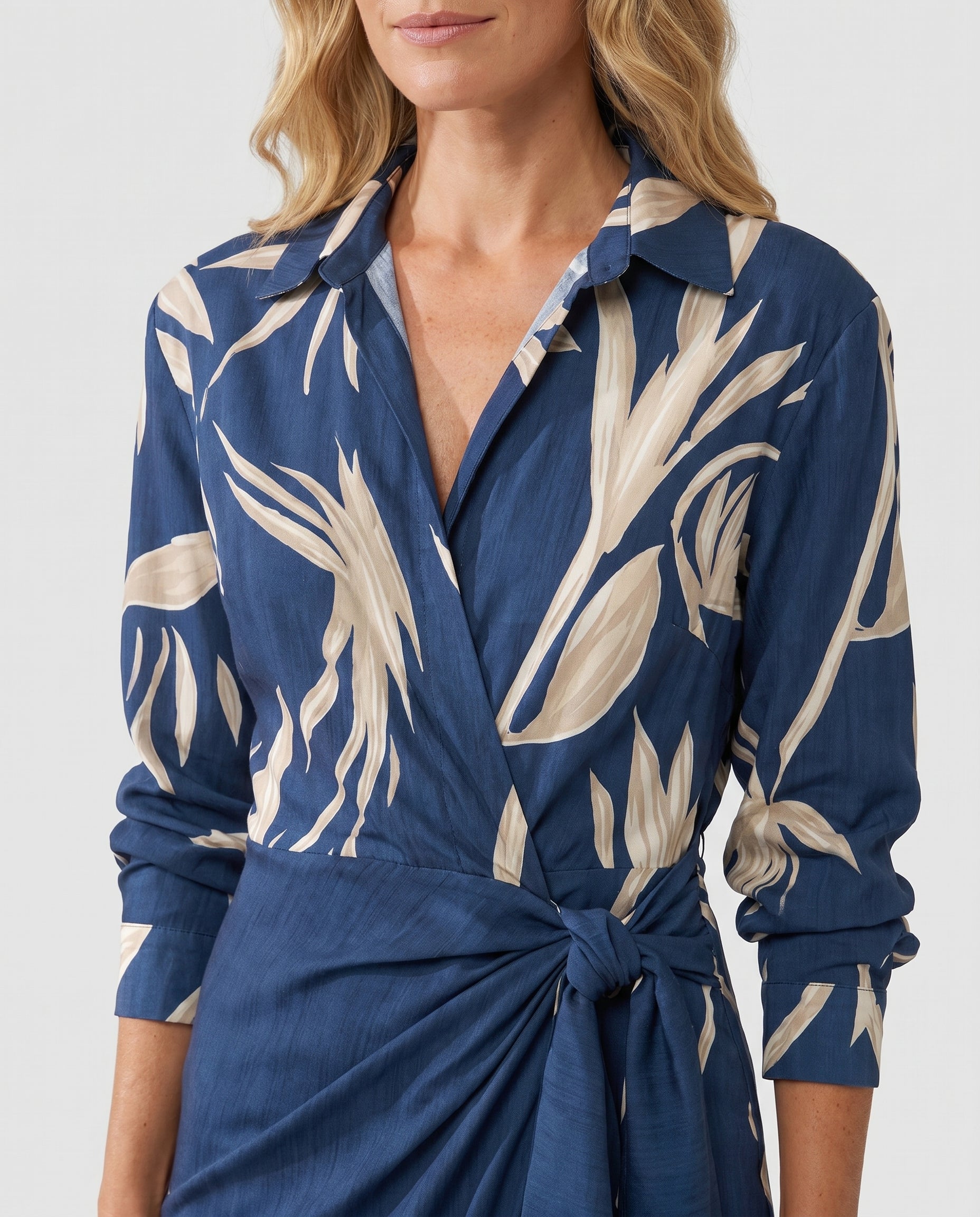 Women's leaf-print wrap dress detail